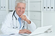 © aletia2011 - portrait of confident old male doctor with stethoscope working in office