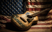 A Worn Vintage American String Guitar Standing In Front Of An Antique American Flag. A Contrast Illustrating The Rich History Of Music In The USA.