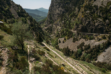 Panoramic view of a mountain gorge in the Vall de Nuria natural reserve in Spain, with trails for hiking in the mountains. A place where you can relax from the hustle and bustle of the city.