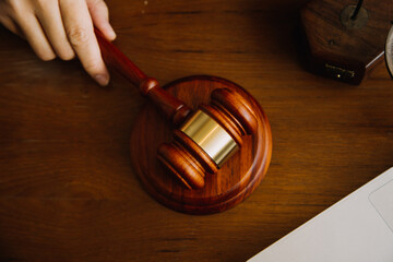 Business and lawyers discussing contract papers with brass scale on desk in office. Law, legal services, advice, justice and law concept picture with film grain effect