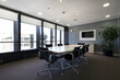 Leinwanddruck Bild - Modern boardroom of a modern office with long wooden table with swivel chairs and newly carpeted floors