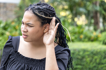 Upset African woman hearing or listening to bad news