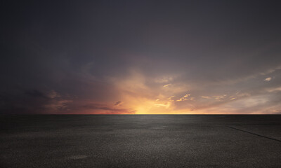 Wall Mural - dark floor background with sunset clouds night sky horizon