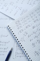 Wall Mural - Notebook with different mathematical formulas and pen, top view