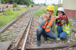 © reewungjunerr - Two engineer working at train station,Work together happily,Help each other analyze the problem,Consult about development guidelines