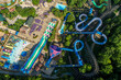 Aerial view of an Amusement Park w/ Roller Coasters and Slides