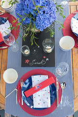 Wall Mural - Overhead view of Fourth of July party table settings