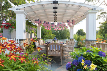 Wall Mural - Festive Fourth of July party table set under garden pergola