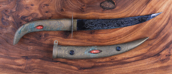 Wall Mural - turkish dagger on wooden background