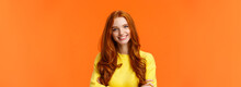 E-commerce, Professionalism And Employement Concept. Cheerful Pleasant Redhead Curly-haired Woman In Yellow Sweater, Standing Confident With Crossed Arms And Smiling Camera