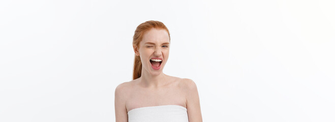 Wall Mural - Portrait of young woman with shocked facial expression.