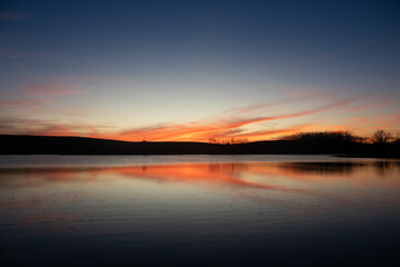 Sunset reflecting upon a pond.