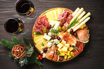 Sticker - Christmas food for romantic dinner at holidays. Antipasto with red wine and christmas decorations.