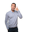 © agongallud - Hesitant young man making a gesture of calling with the hand