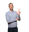 © agongallud - Young man making a number three gesture