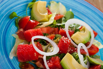 Wall Mural - Healthy summer salad with watermelon, avocado, tomatoes, grapefruit and corn salad