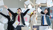 © Bangkok Click Studio - Millennial Asian young professional successful male female businessmen businesswomen in formal suit laughing smiling throwing paperwork documents up in air celebrating together in company office