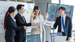 © Bangkok Click Studio - Millennial Asian young stressed upset businesswoman employee in formal suit denying graph chart strategy paperwork document reports from lazy male female colleagues in company office meeting room