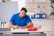 © Elnur - Young male doctor working in the clinic