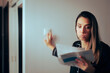 © nicoletaionescu - Woman Checking Electricity Bill Turning out the Lights at Home. Worried lady afraid of power pricing during energetic crisis