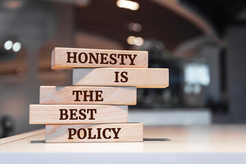 Poster - Wooden blocks with words 'Honesty Is The Best Policy'.