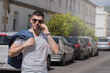 © tetxu - casual man with mobile phone on the street