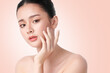 © kitthanes  - Beautiful young asian woman with clean fresh skin on beige background, Face care, Facial treatment, Cosmetology, beauty and spa, Asian women portrait.