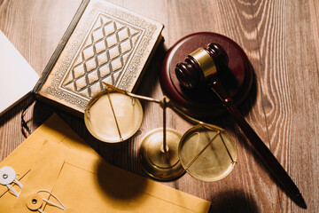 Business and lawyers discussing contract papers with brass scale on desk in office. Law, legal services, advice, justice and law concept picture with film grain effect