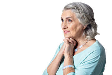 Poster - Beautiful senior woman posing against white background