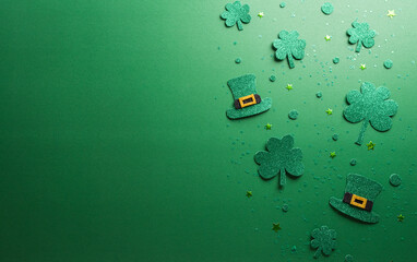 Wall Mural - Happy St Patrick's Day decoration concept made from shamrocks ( clover leaf) and leprechaun hat on green background.