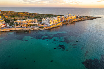 Wall Mural - Marsaskala village and seascape, Malta at sunrise. Aerial Drone view