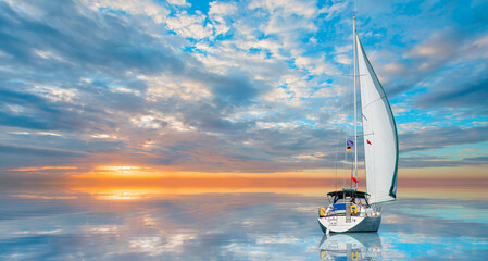 Wall Mural - Lonely yacht sailing in the Mediterranean sea at amazing sunset - Sailing luxury yacht with white sails in the Sea.