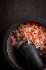 Wall Mural - Pink himalayan salt in mortar. Top view.