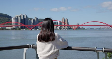 Poster - Woman walk though the riverside in Tamsui Guandu Bridge of Taiwan