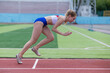 © Михаил Решетников - Young caucasian woman is engaged in jogging at the stadium outdoors.