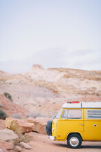 A Vintage Yellow Van Is Parked At A Trailhead In The San Rafael Swell, Utah.