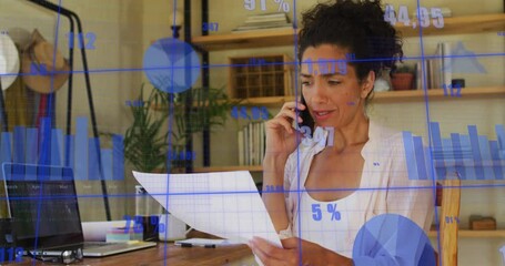 Canvas Print - Animation of financial data processing over biracial businesswoman using smartphone in office