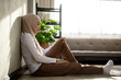 © krumanop - Muslim girl in hijab sit alone under table get bad news feel depressed and frustrated muslim woman suffering from illness worried about unresolved problems feeling sorrow grief hard. Soft focus