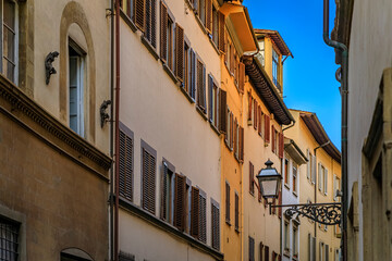 Wall Mural - Gothic buildings on a narrow street in Centro Storico of Florence, Italy