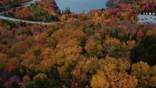Aerial Of Blue Lake In The Mountains Surrounded By Fall Foliage. Drone Of Lake In New Hampshire Revealing Autumn Trees In Mountains.