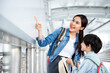 © krumanop - Couple of tourists ready for travel with happiness and brights mile at airport. Ready for vacation trip, Sitting with suitcase on sky walk. Family and finding location for education concept.