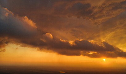 Wall Mural - A wonderful dawn above the clouds. Natural background