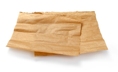 Baking paper isolated. Crumpled pieces of brown parchment or baking paper on white background. Design element.