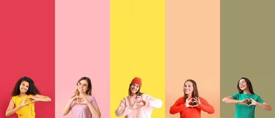 Wall Mural - Set of beautiful young women making heart with their hands on color background