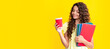 © Olena - Student teen girl with books hold takeaway delivery cup coffee isolated on yellow background. Education in college concept. Banner of schoolgirl student. School child pupil portrait with copy space.