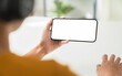 © sitthiphong - Hand holding digital smartphone mockup of blank screen. Take your screen to put on advertising.
