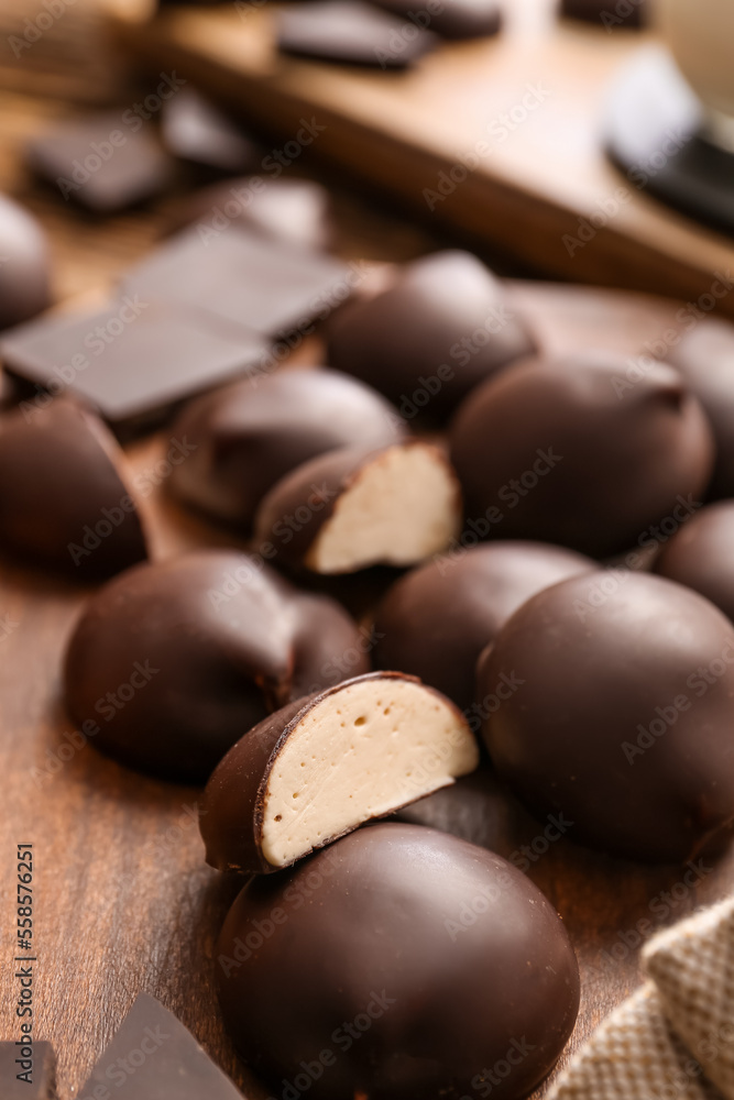 Delicious bird's milk candies on board, closeup