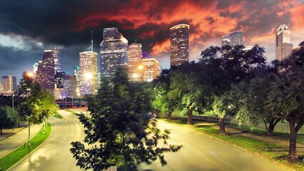 Wall Mural - Time lapse of Houston, Texas modern skyline at sunset twilight from park lawn