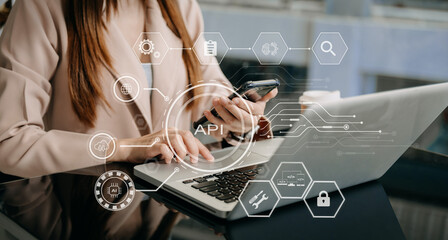 API Application Programming Interface, woman using laptop, tablet and smartphone with virtual screen API icon Software development tool, modern technology .
