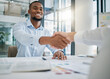 © Lou W/peopleimages.com - Hiring, designer or black man shaking hands with human resources manager for a successful job interview in office. Handshake, meeting or worker with a happy smile for a job promotion or business deal